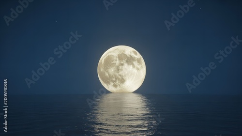 full moon rising over calm ocean water at night