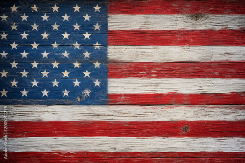 Distressed American flag painted on a rustic wooden plank background.