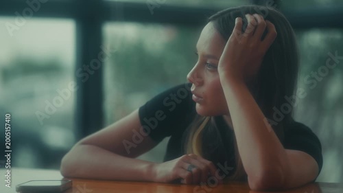 Calm Female Portrait. Serene Female Figure Gazing Thoughtfully Into Distance Under Gentle Light