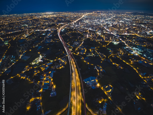Aerial View of Taoyuan City - City, Transport, High altitude nightscape concept image. Long exposure birds eye view use the drone, shot in Taoyuan, Taiwan.