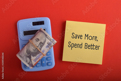Fényképezés Save More Spend Better Concept with Cash and Calculator