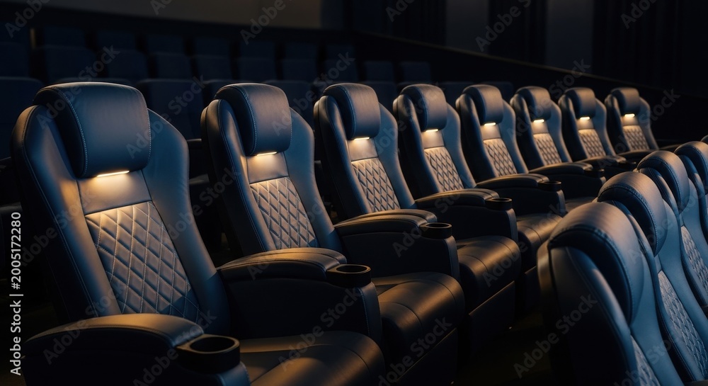 Fototapeta premium Rows of Upscale Navy Blue Cinema Seats with Integrated Lighting and Cup Holders in a Dark Auditorium