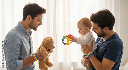 Two adult men holding a baby and a teddy bear. All are wearing rainbow bracelets, suggesting LGBTQ+ family support, love, and togetherness