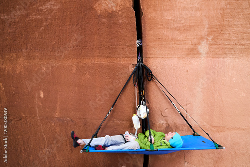 Εκτύπωση καμβά Rock climber relaxing on portaledge during big wall ascent