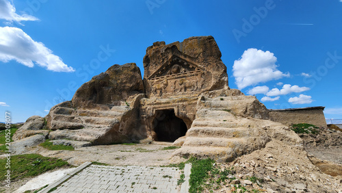 In Eskişehir, Turkey, the Solon’s Tomb (Lion Temple) in Phrygian Valley, showing its rock-cut façade with Roman-era lion reliefs beneath a triangular pediment featuring symbolic motifs