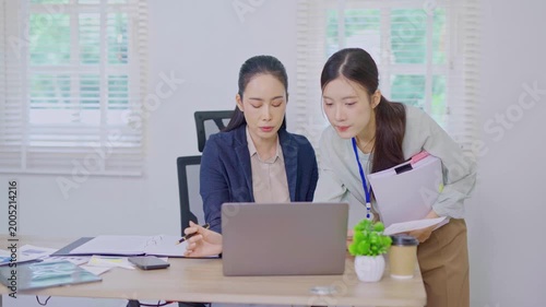 A team of business professionals analyzes financial performance, reviews charts and graphs, and collaborates on strategic planning for a modern corporate office.
