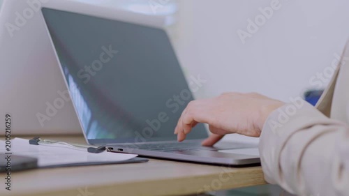 Asia beautiful business woman working with laptop in living room at office