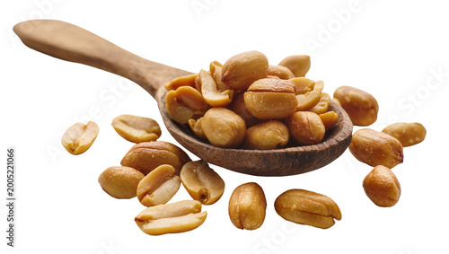 Tableau sur toile Wooden Spoon Overflowing with Roasted Salted Peanuts