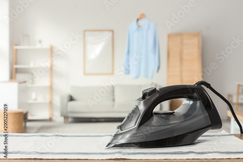 Black iron with towel on ta...