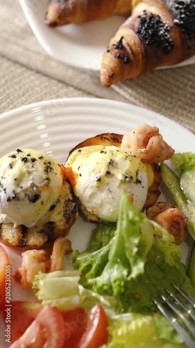 Home breakfast with croissants and coffee in the morning. A sunny start to the day with delicious food.