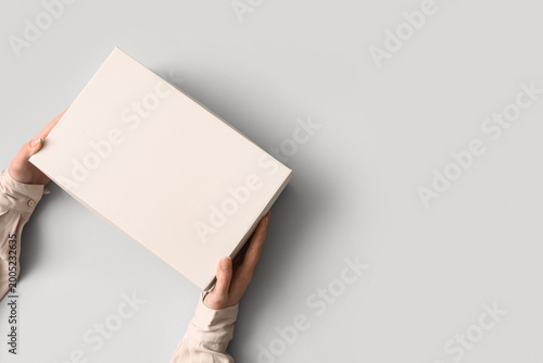 Female hands holding shoebo...
