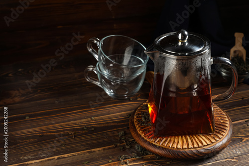 Teapot of hot black tea on ...