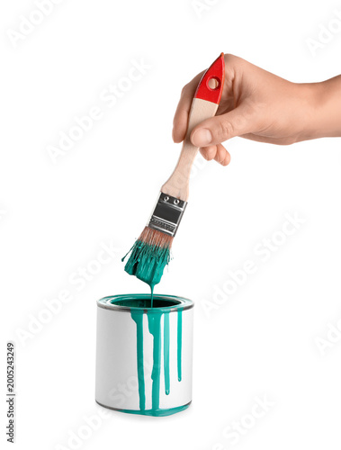 Female hand with can of tur...