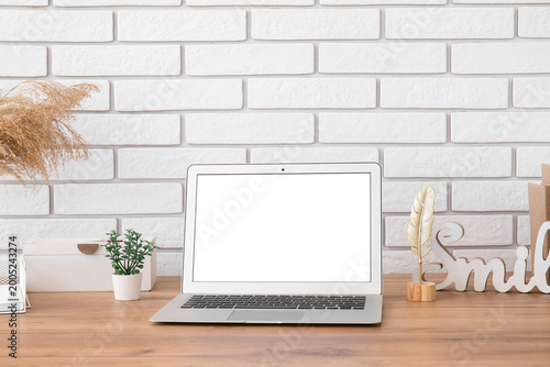 Modern laptop and decor on ...