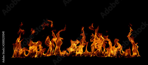 Canvas Print Realistic fire flames isolated on black background, burning orange blaze with dynamic heat motion, ideal for overlay, visual effects, cinematic scenes, and dramatic design compositions