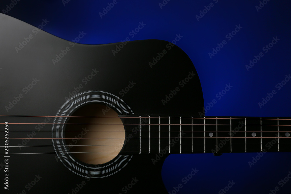 Obraz premium Modern guitar on dark background, closeup