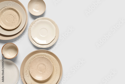 Set of beige plates and bow...