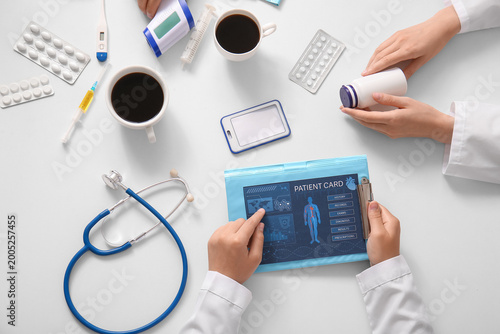 Doctors with patient card, ...