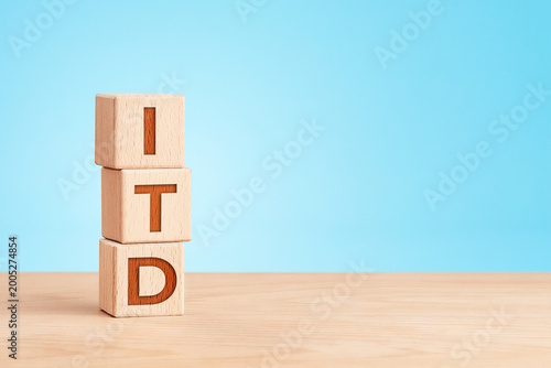 Information technology concept with wooden cubes on blue background