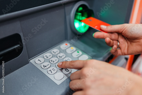 Cuadro en lienzo Entering PIN code to access personal bank account in ATM
