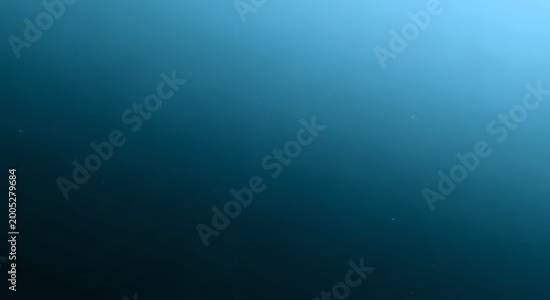 A serene underwater scene with a gradient of deep blue to light blue, suggesting depth and tranquility.