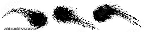 Billede på lærred Black ink splashes with paint splatter effects and trailing particles in artisti