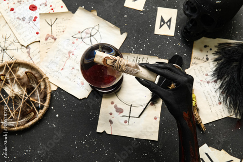 Bloody witch hand with magi...