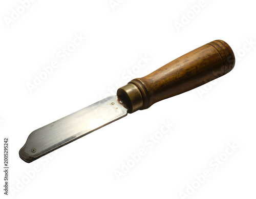 Old wooden handled tool with curved metal blade