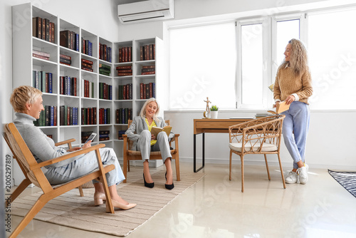 Mature women reading books ...
