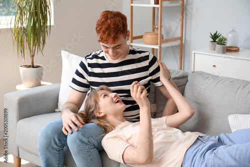 Happy young couple with pre...