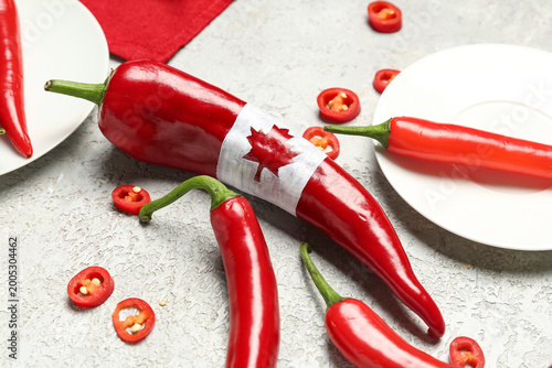Chili pepper with drawn fla...