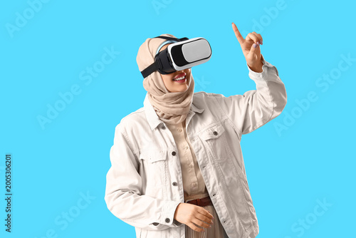 Young Arabian woman with VR...