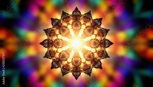 a colorful mandala design with intricate patterns. A glowing center emanates light, enhancing the vibrant colors and detailed shapes.