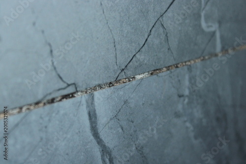 Fotografi Black mold and fungus growing in bathroom tile grout close up