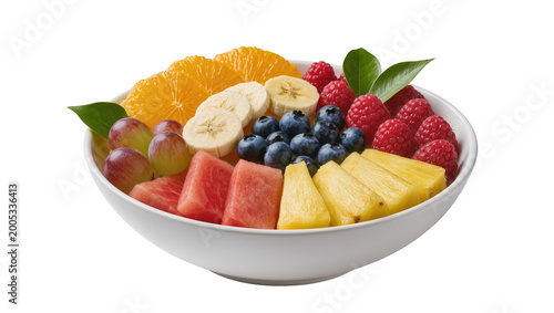 Fresh sliced fruits assortment in white ceramic bowl