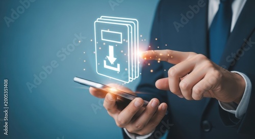 Businessman in blue suit using smartphone with glowing download icon on screen