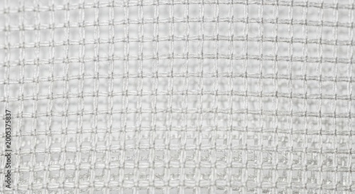 fabric texture - close-up of textured fabric with intricate weave pattern and subtle sheen