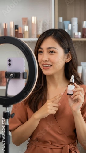 Young woman is live streaming introducing beauty products