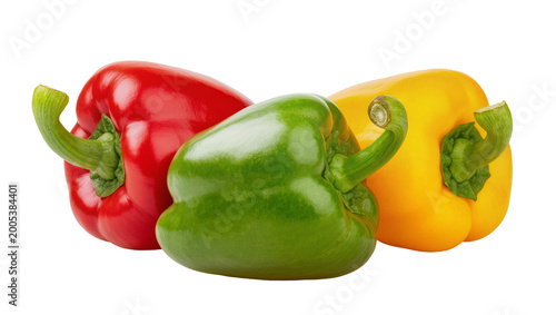 Foto Red green yellow bell peppers with stems close-up