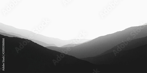 Cuadro en lienzo A serene morning landscape reveals a majestic mountain range shrouded in misty b