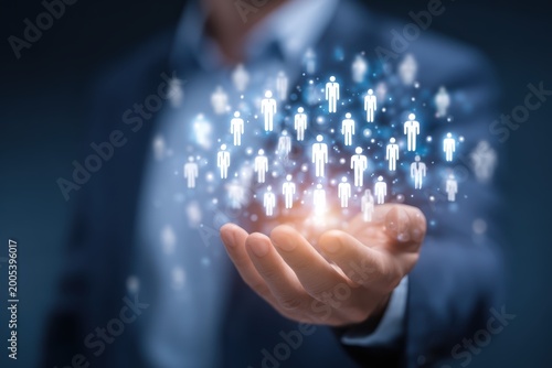 Businessman holding glowing network of people in his hand