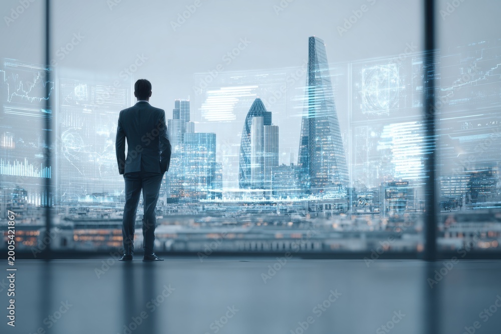 Fototapeta premium Businessman looking at futuristic city data interface at night