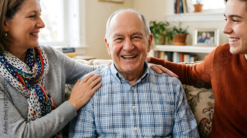 Smiling senior man with happy adult children in cozy living room with warm natural lighting for family relationships