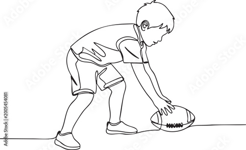 Child Bending to Pick Up Football  Natural Soccer Action Pose