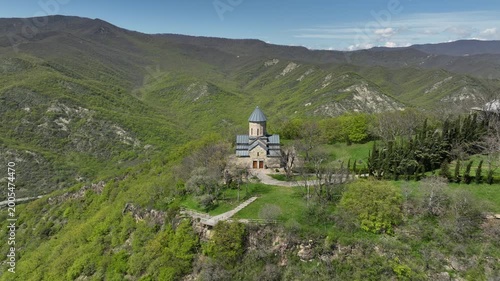 Aerial shot of the Mamkoda Monastery, located near Tbilisi. The image captures the historic stone architecture of the church and its surrounding monastic buildings