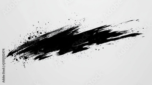 Abstract black paint splatter on a light gray background