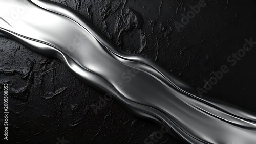 A smooth stream of liquid metal flowing across a dark, rough surface. 