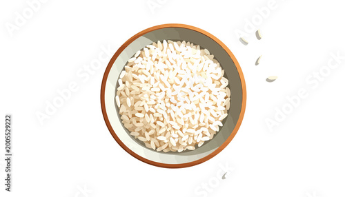 Overhead view of a ceramic bowl filled with white grains and a few scattered beside it