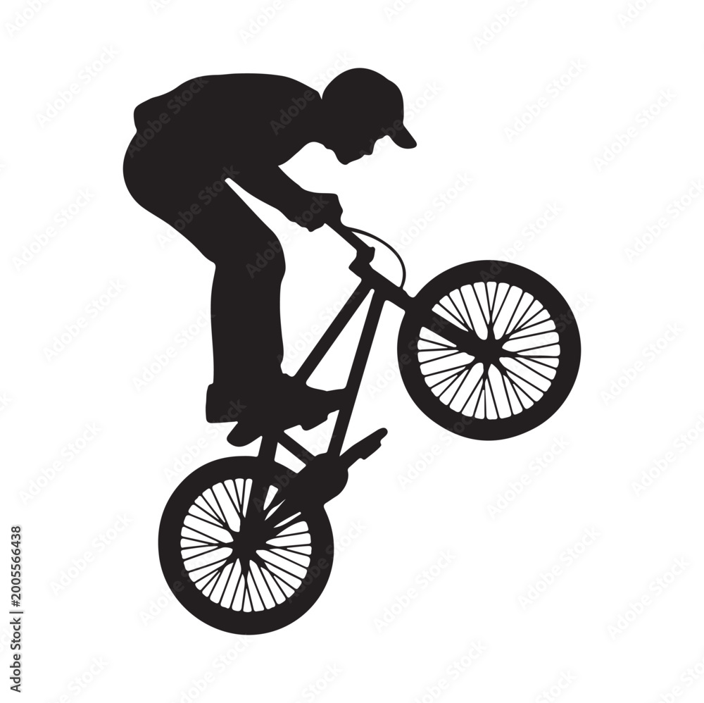 Fototapeta premium Silhouette of man performing trick on bmx bike
