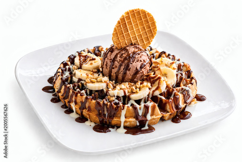 Belgian waffle with chocolate ice cream banana and chocolate topping isolated dessert